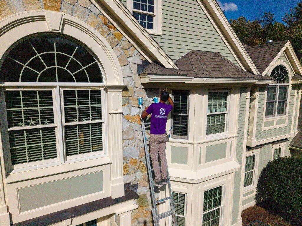 Exterior Trim Repair in Massachusetts: How to Handle Rot, Water Damage, and Weather Wear 3 GL Alliance Painting Crew Member Painting exterior House near me in Newton, MA
